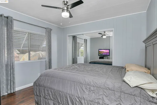 a bedroom with a bed and a chair