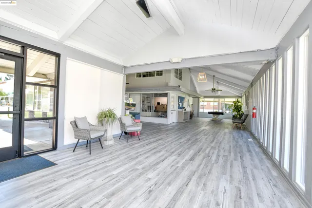 a view of a a dining room with furniture window and outside view