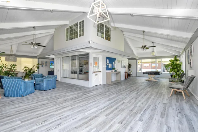 a kitchen with stainless steel appliances granite countertop a stove a refrigerator a sink and dishwasher