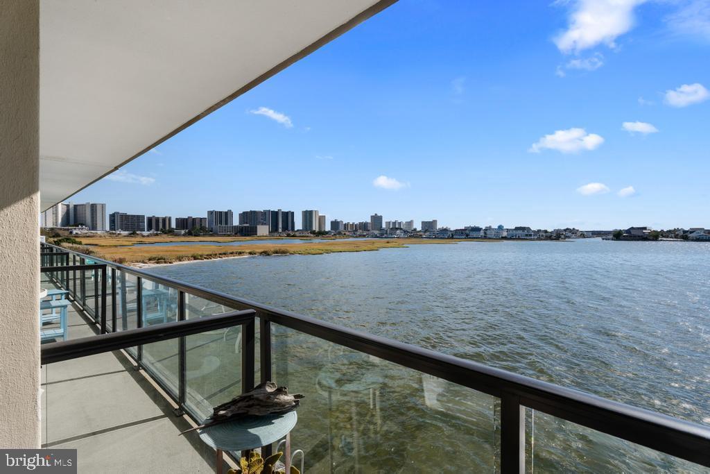 169 Jamestown Road, Unit 20601 Ocean City, MD 21842 - Photo 2 of 35 a view of swimming pool with outdoor seating and lake view