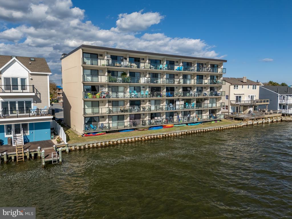 169 Jamestown Road, Unit 20601 Ocean City, MD 21842 - Photo 7 of 35 a front view of a building with lake view