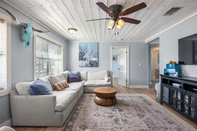 a spacious bedroom with a bed and furniture