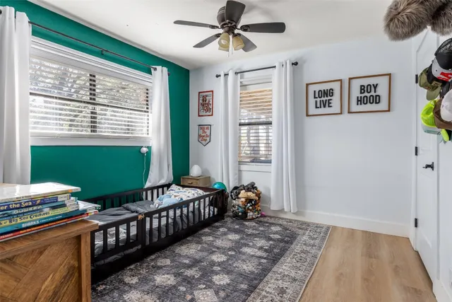 a bedroom with furniture and a window
