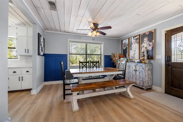 a dining room with furniture and window