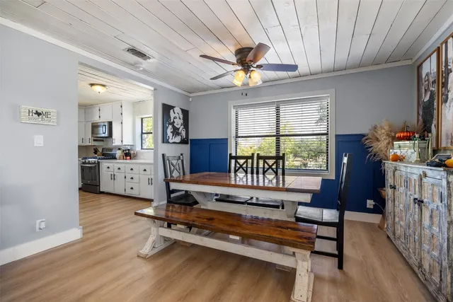 a living room with furniture fireplace and windows