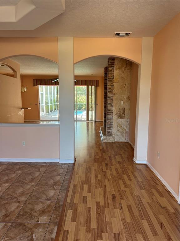 15296 Southwest 15th Terrace Road Ocala, FL 34473 - Photo 3 of 6 wooden floor in an empty room with a window