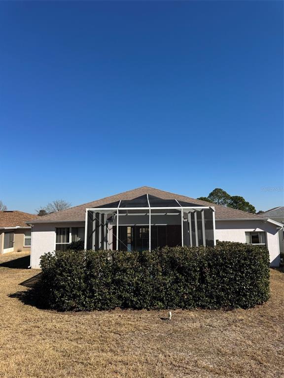 15296 Southwest 15th Terrace Road Ocala, FL 34473 - Photo 4 of 6 a front view of a house with a garden