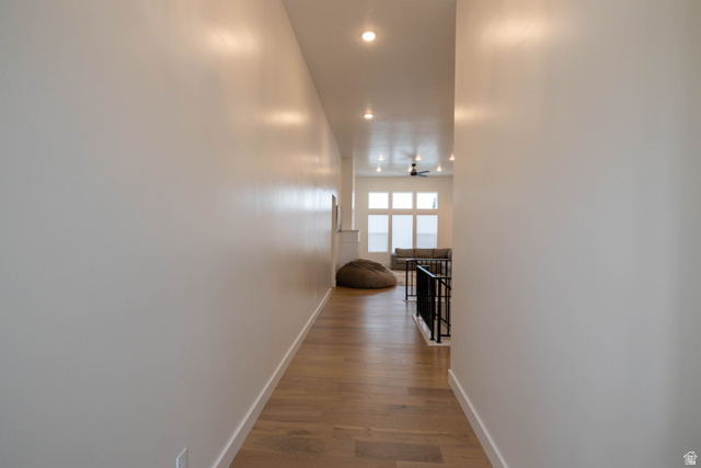 293 North Pheasant Drive Mapleton, UT 84664 - Photo 2 of 20 Hallway featuring dark wood finished floors, recessed lighting, and an upstairs landing