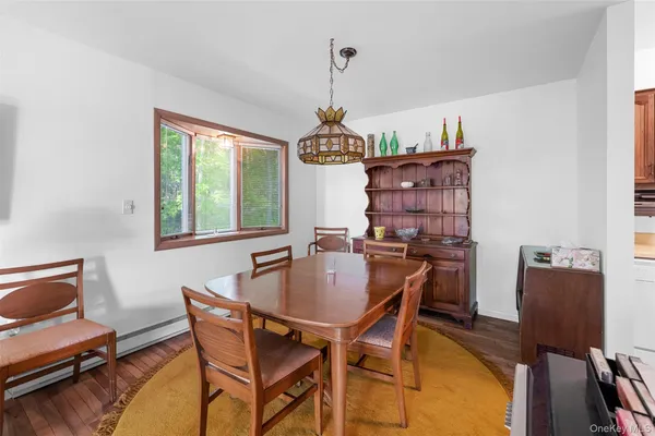 a dining room with furniture and window