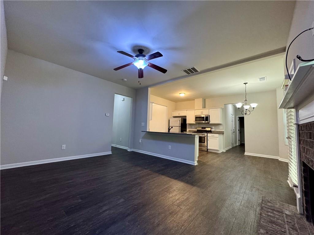 98 Baywood Way Hiram, GA 30141 - Photo 12 of 55 a view of a kitchen with a sink a microwave and a refrigerator