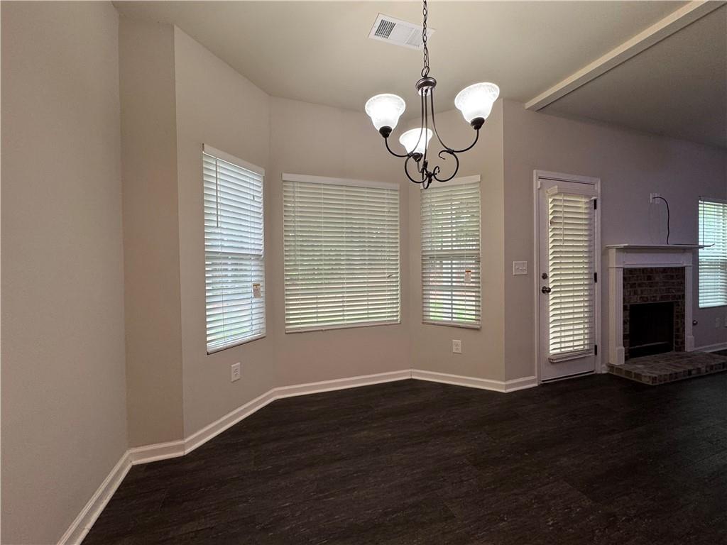 98 Baywood Way Hiram, GA 30141 - Photo 14 of 55 a view of a room with wooden floor and chandelier