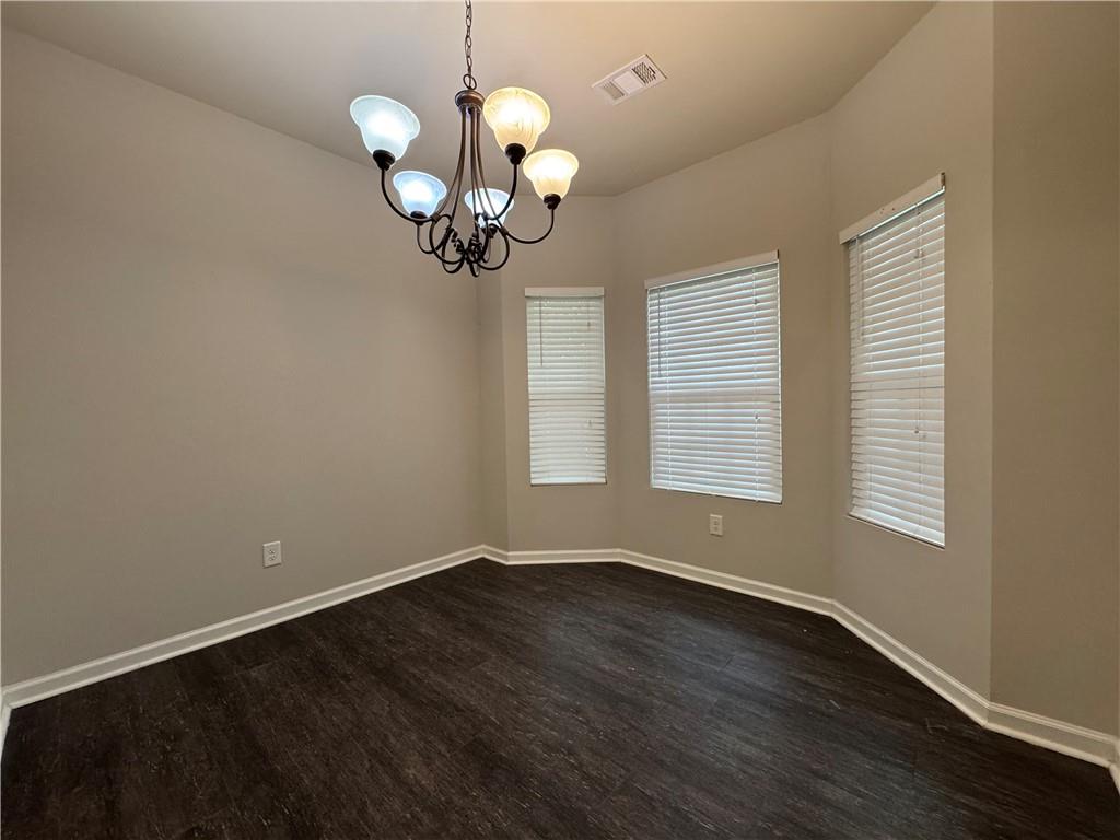 98 Baywood Way Hiram, GA 30141 - Photo 15 of 55 a view of a room with wooden floor and chandelier