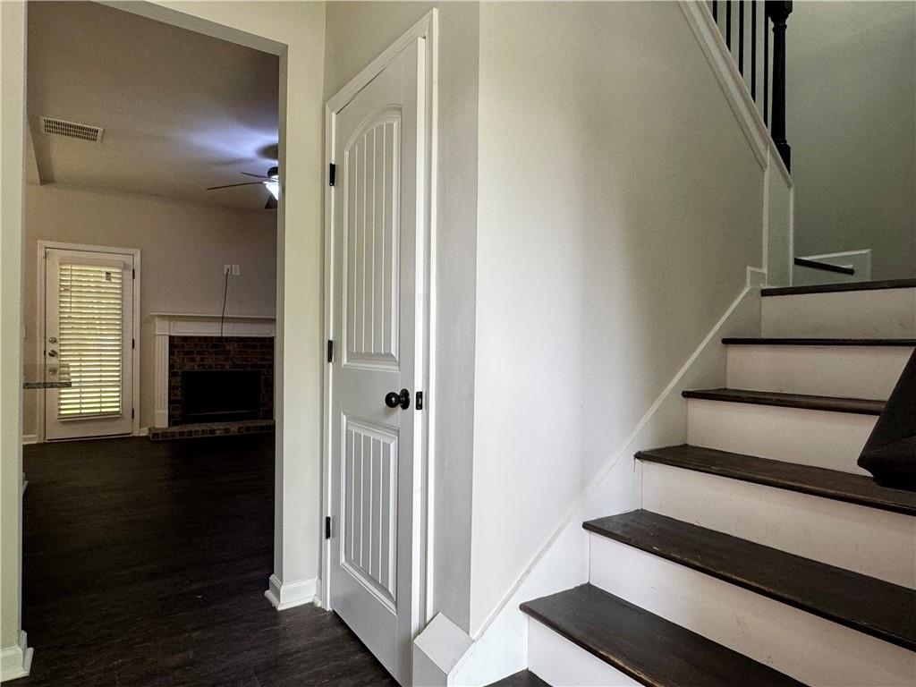 98 Baywood Way Hiram, GA 30141 - Photo 23 of 55 a view of a hallway with wooden floor and staircase