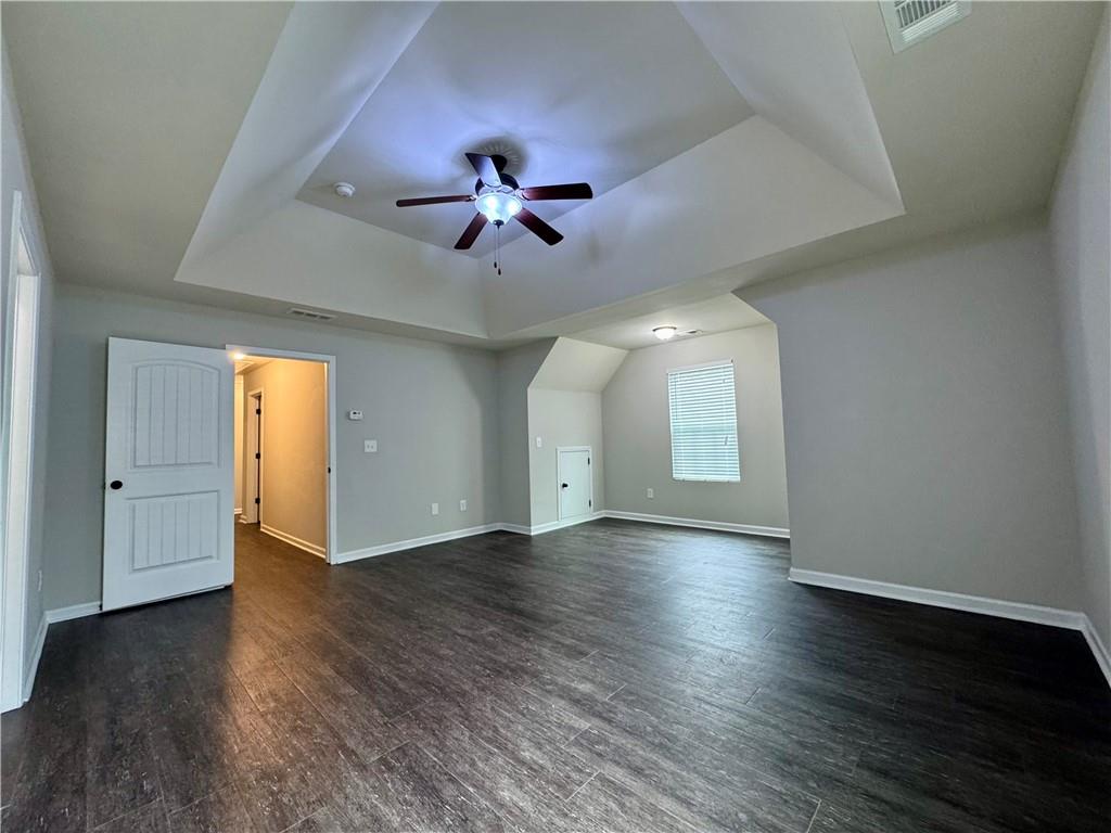 98 Baywood Way Hiram, GA 30141 - Photo 26 of 55 a view of an empty room with a window and wooden floor