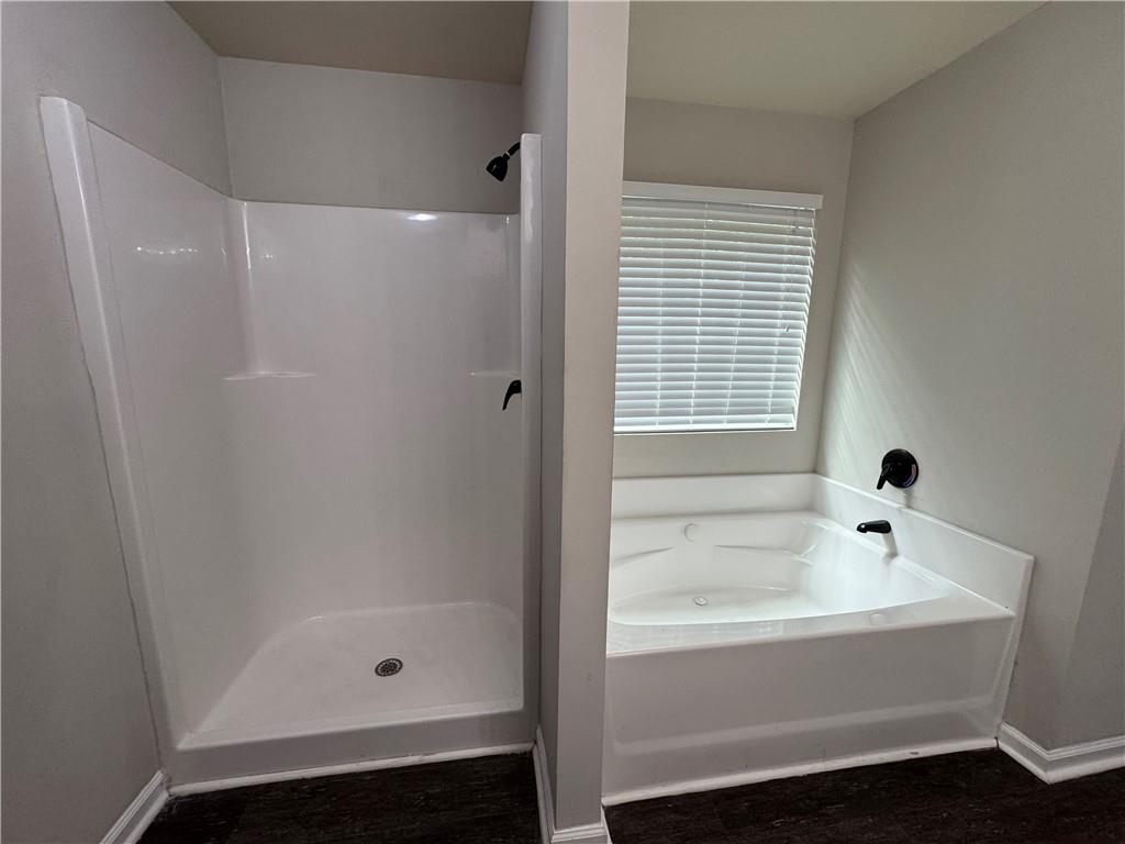 98 Baywood Way Hiram, GA 30141 - Photo 30 of 55 a bathroom with a bathtub and shower