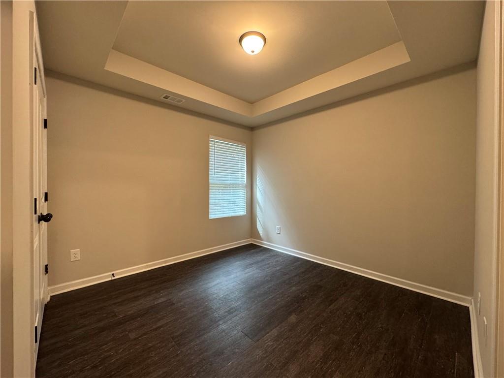98 Baywood Way Hiram, GA 30141 - Photo 39 of 55 a view of an empty room with wooden floor and a window