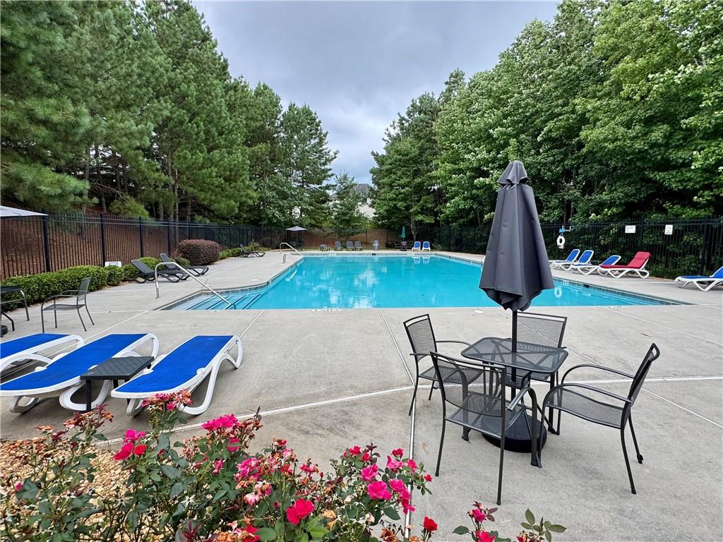 98 Baywood Way Hiram, GA 30141 - Photo 48 of 55 a view of backyard with swimming pool and furniture