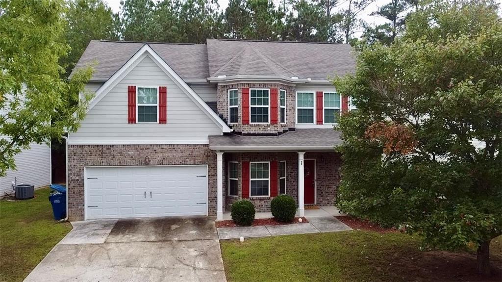 98 Baywood Way Hiram, GA 30141 - Photo 55 of 55 a view of a yard in front of a house with plants and large tree