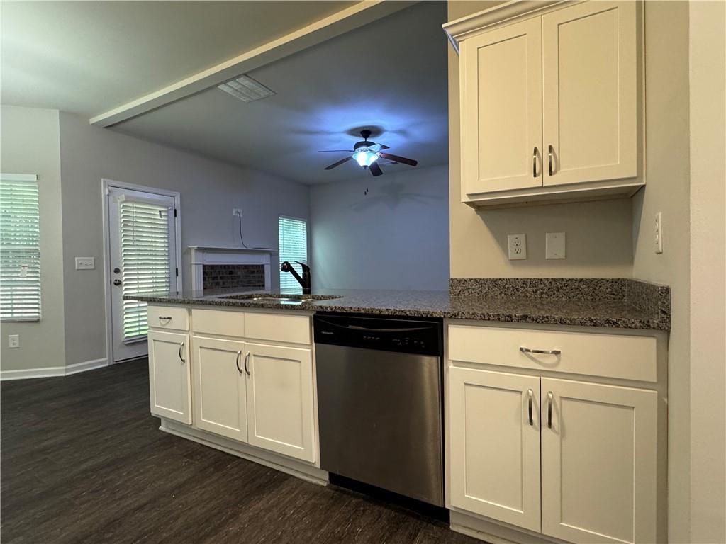98 Baywood Way Hiram, GA 30141 - Photo 10 of 55 a kitchen with granite countertop white cabinets and a stove
