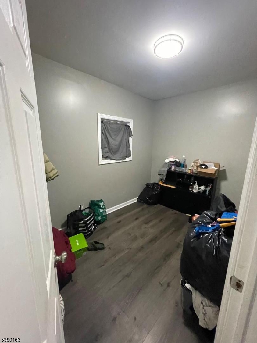 162 Lyon Street Paterson, NJ 07524 - Photo 13 of 25 a bedroom with a bed and a window