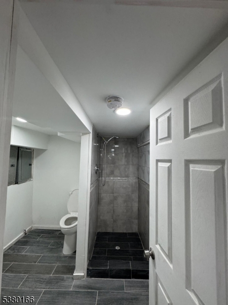 162 Lyon Street Paterson, NJ 07524 - Photo 2 of 25 a bathroom with a sink and a shower