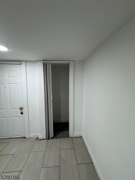 162 Lyon Street Paterson, NJ 07524 - Photo 6 of 25 an empty room with closet