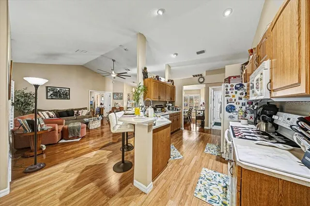 a living room with lots of furniture and painting on the wall