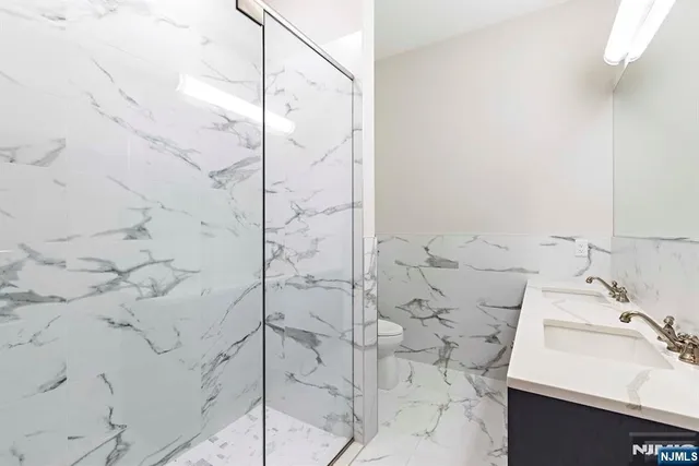 a bathroom with a sink and shower