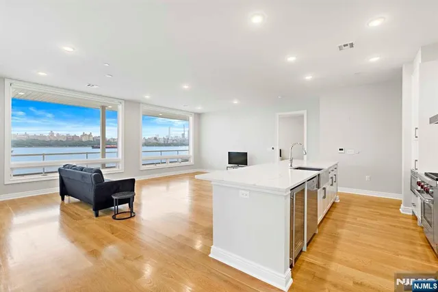 a view of kitchen with cabinets and wooden floor