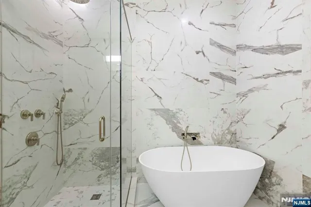a white tub sitting in a bathroom