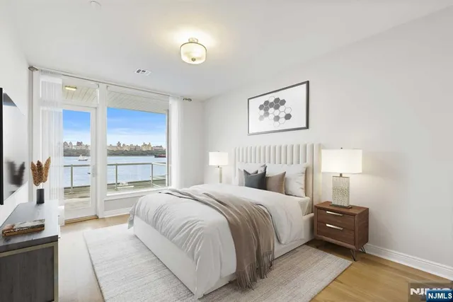 a bedroom with a bed and a view of kitchen