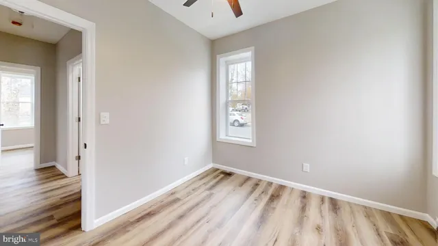 a view of a yard with snow on the road