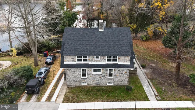 a view of a kitchen with wooden floor and a sink