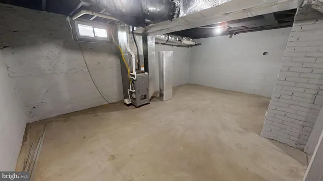 a living room with furniture and a sink