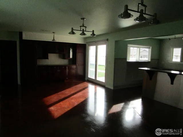 a lobby with furniture and chandelier