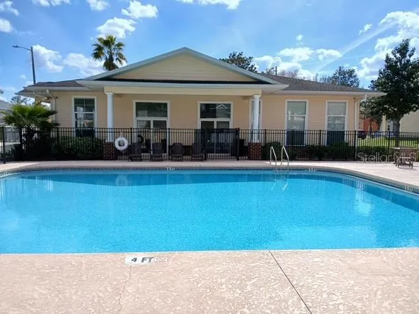 a front view of house with yard and outdoor seating