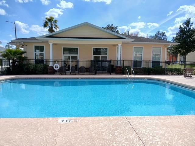 1583 Northwest 29 Road, Unit 2 Gainesville, FL 32605 - Photo 13 of 20 a front view of house with yard and outdoor seating