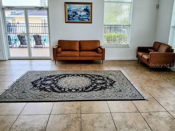a living room with a couch and a window