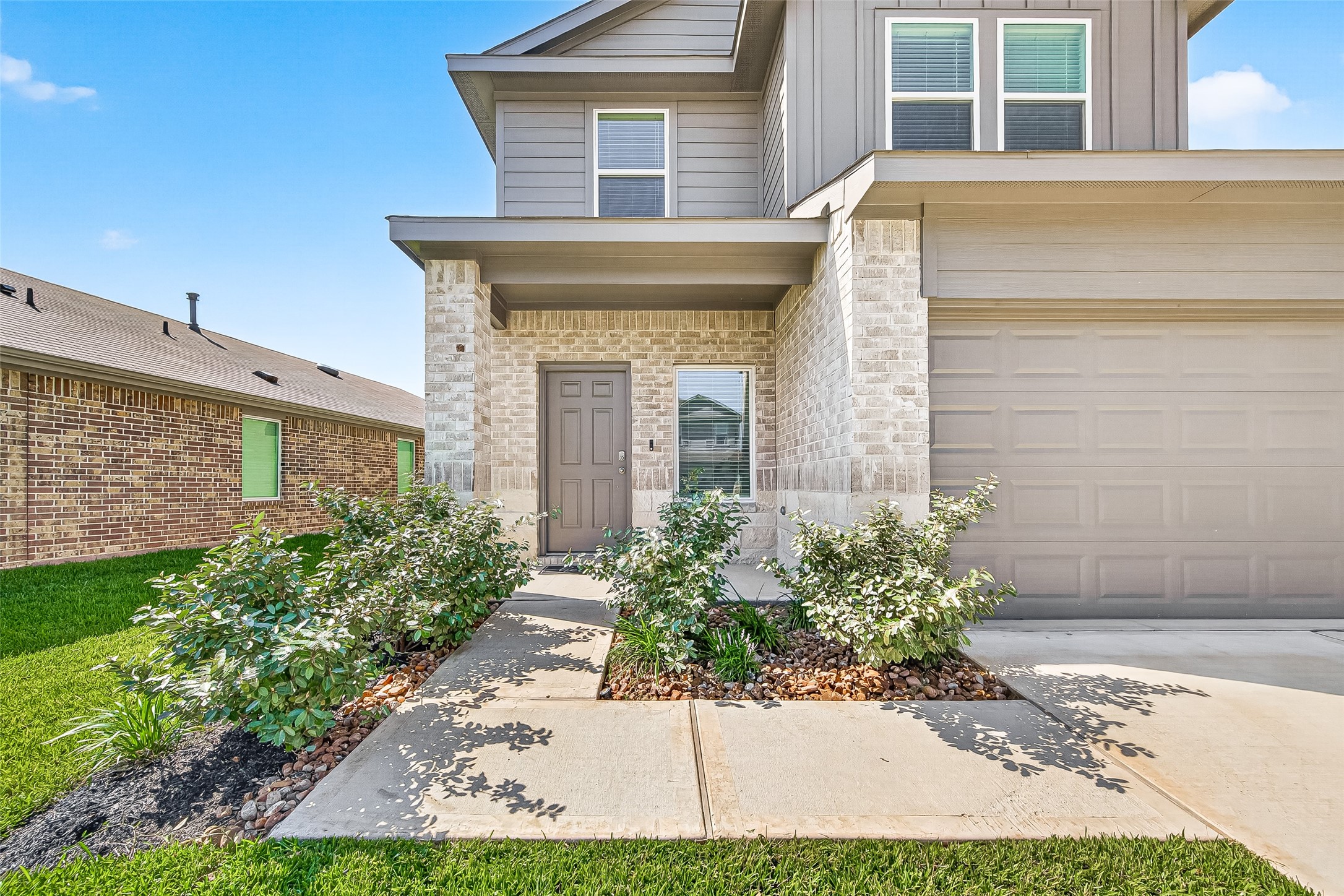 5442 Pinetree Cres Lane Spring, TX 77373 - Photo 3 of 24 Lush landscaping beautifully accents the entrance creating stunning curb appeal and a warm welcome