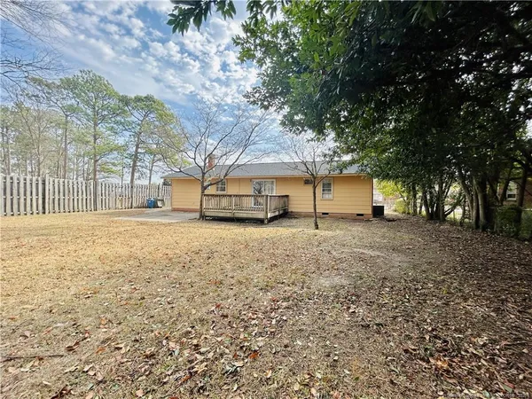 a house with trees in front of it