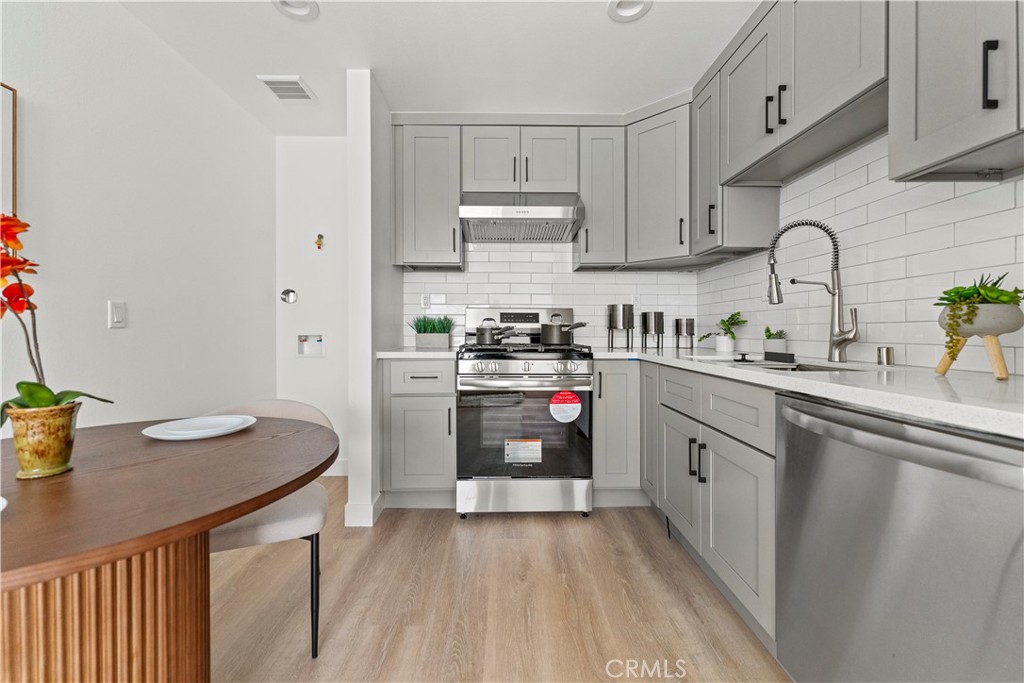 600 South Brookhurst Road Fullerton, CA 92833 - Photo 1 of 1 a kitchen with stainless steel appliances a sink dishwasher stove refrigerator and cabinets