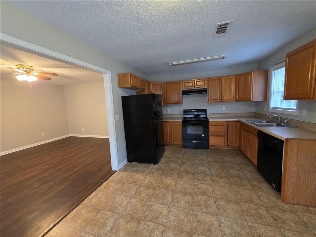 2325 Shady Grove Road, Unit A Carrollton, GA 30116 - Photo 13 of 42 a kitchen with stainless steel appliances granite countertop a refrigerator and a sink