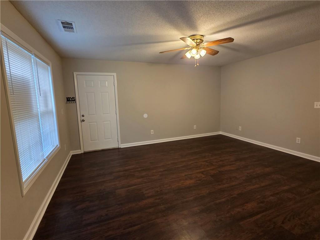 2325 Shady Grove Road, Unit A Carrollton, GA 30116 - Photo 21 of 42 wooden floor in an empty room with a window