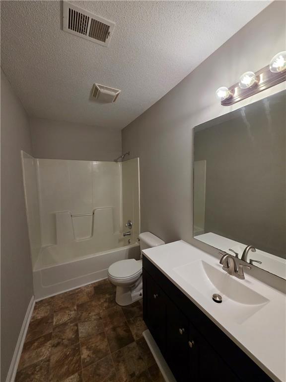 2325 Shady Grove Road, Unit A Carrollton, GA 30116 - Photo 27 of 42 a bathroom with a sink toilet a mirror and vanity