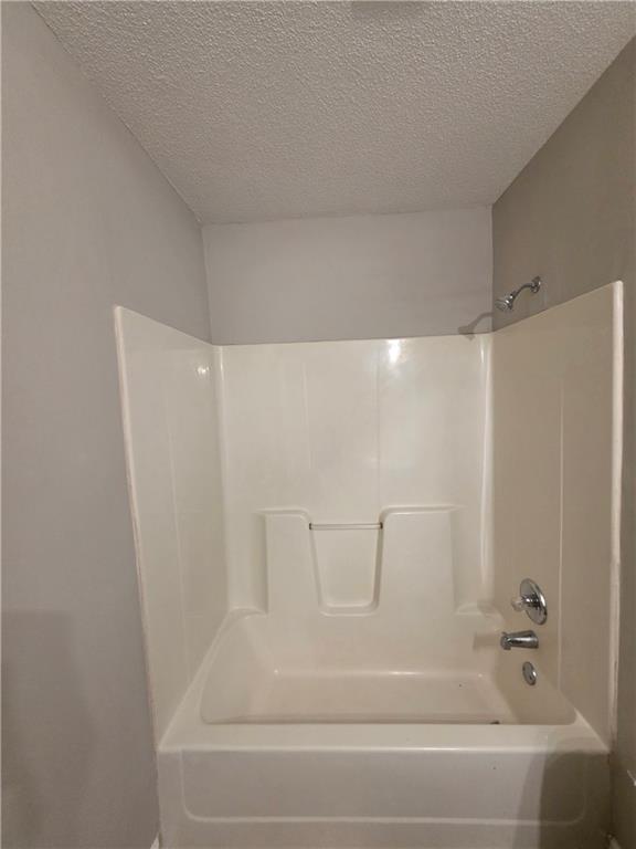 2325 Shady Grove Road, Unit A Carrollton, GA 30116 - Photo 28 of 42 a bathroom with a bathtub and shower