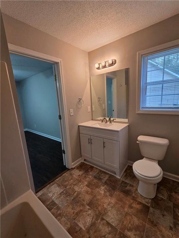 2325 Shady Grove Road, Unit A Carrollton, GA 30116 - Photo 40 of 42 a bathroom with a sink toilet and mirror