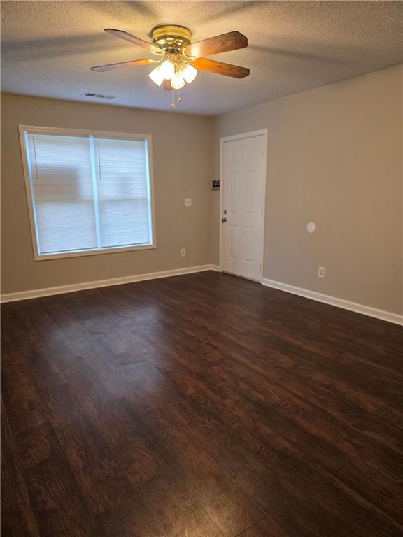 2325 Shady Grove Road, Unit A Carrollton, GA 30116 - Photo 4 of 42 a view of an empty room with wooden floor and a window