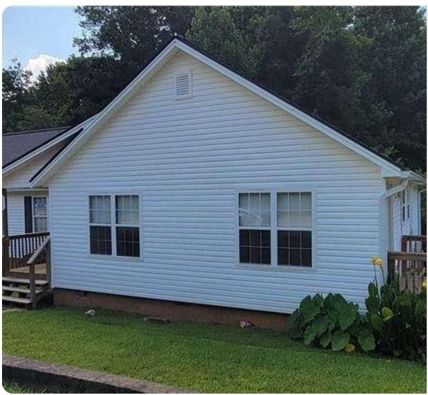 2325 Shady Grove Road, Unit A Carrollton, GA 30116 - Photo 42 of 42 a view of a house with a yard and potted plants