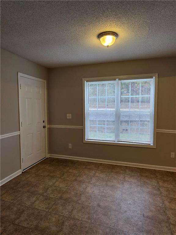 2325 Shady Grove Road, Unit A Carrollton, GA 30116 - Photo 9 of 42 an empty room with windows