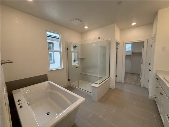 a bathroom with a shower and a sink